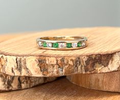 This 9k yellow gold ring has alternate round cut green and white cubic zirconia in a channel setting leading to a plain band.   Stamped 9K and CZ. UK size J   US size 5 Rings can be resized at most high street Jewellers at a minimal cost.  Or if you prefer I can have my goldsmith resize it for you (within reason) at an additional cost from £20 ($30).  All you have to do is add the listing 'Please resize my ring' to your cart. Channel Setting, J Us, 5 Rings, Plain Bands, Cubic Zirconia Rings, Cz Ring, Multi Stone Ring, Multi Stone, Yellow Gold Rings