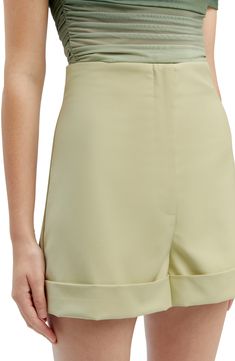 A flat front details these cuffed shorts topped with a high waist and finished with back pockets. 2 1/2" inseam; 25 1/2" leg opening; 12 3/4" front rise; 17" back rise Zip fly with hook-and-bar closure Back welt pockets Partially lined 97% polyester, 3% elastane Hand wash, line dry Imported Chic Fitted High Waist Bermuda Shorts, High Waist Solid Bermuda Shorts For Spring, Solid Color High Waist Bermuda Shorts For Spring, Solid High Waist Bermuda Shorts For Spring, Classic High-waisted Bermuda Shorts For Summer, Classic High-waisted Shorts For Spring, Fitted Bermuda Shorts With Belt Loops For Spring, Spring High-waisted Bermuda Shorts With Belt Loops, High-waisted Bermuda Shorts With Belt Loops For Summer