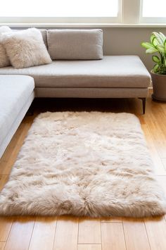 A luxurious medium-sized rug, our 3' x 5' long-wool area rug marks the spot where you want to sit by the fireplace or stand in your bare feet. Use it in the den or the family room, drape it on the loveseat, or put it beside your bed where you set your feet down first thing in the morning. Its lofty 3" pile lends cozy warmth and luxury, while 100% cotton backing keeps the rug in place.  Made of fine Australian sheepskin and crafted in China. Library Nook, Australian Sheep, Cozy Rug, Cozy Rugs, First Thing In The Morning, The Den, Coffee Cozy, Sheepskin Rug, Shaggy Rug