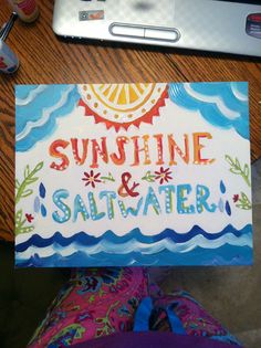 a card with the words sunshine and saltwater on it sitting next to a laptop