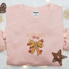 Autumn Girly Coquette Bow Embroidered Shirt As the leaves begin to paint the world in hues of crimson and gold, there’s no better time to envelop yourself in the cozy charm of autumn. Tinicloset invites you to experience the season’s magic through our exquisite collection of embroidered sweatshirts, T-shirts, and hoodies. Our Autumn Girly Coquette... Cute Floral Embroidery Fall Tops, Holiday Embroidered Tops For Fall, Cute Custom Embroidered Tops For Fall, Cute Tops With Custom Embroidery For Fall, Pink Custom Embroidered Tops For Fall, Pink Tops With Custom Embroidery For Fall, Pink Top As Gift For Fall, Pink Top As Fall Gift, Halloween Embroidery Shirts