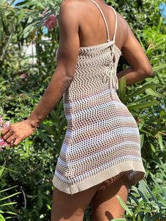 This tan and white crochet dress is the perfect cover up for your next vacation. Its versatile design makes it a must-have for any getaway, and its mini dress length adds a touch of style. Add this vacation essential to your wardrobe today. Casual Mini Length Cover-up For Beach Party, Crochet Sundress For Beach Cover-up, Casual Mini Length Beach Season Cover-up, Beige Crochet Dress For Beach Cover-up, Beach Season Crochet Mini Dress Cover-up, Mini Crochet Dress For Beach Party, Spring Vacation Mini-length Crochet Dress, Spring Vacation Mini Crochet Dress, Beige Sundress For Beach