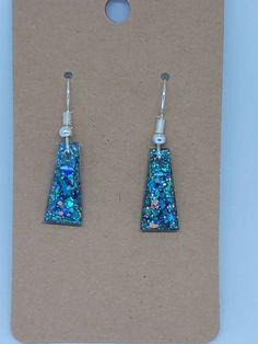 Check out this item in my Etsy shop https://www.etsy.com/listing/717586453/resin-earrings Blue Resin Jewelry For Parties, Blue Resin Jewelry For Party, Green Glitter Earrings As A Gift, Silver Resin Drop Earrings, Iridescent Glitter Earrings As Gift, Iridescent Glitter Earrings For Gift, Sparkling Blue Earrings For Gift, Iridescent Glitter Earrings For Party, Elegant Blue Resin Earrings