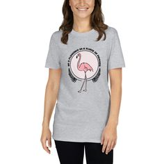 Let your flamingo spirit fly free with this t-shirt that any lovers of the fabulous fowl will enjoy! Full of personality, this flamingo t-shirt is available in a handful of colors, so you can combine it seamlessly with your outfits. Made from 100% ring-spun cotton, this unique piece of flamingo merch is meant for casual living - its light and soft features are great for lounging around the house on a lazy Sunday, taking a leisurely stroll through the neighborhood, or running errands around town. Pink Short Sleeve T-shirt With Flamingo Print, Pink Flamingo Print Short Sleeve T-shirt, Casual Pink T-shirt With Flamingo Print, Casual Pink Flamingo Print T-shirt, Flock Of Pigeons, Be A Flamingo, Soft Features, Tropical Flamingo, Flamingo Shirt