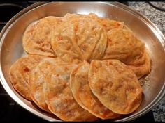 some food is sitting in a pan on the stove