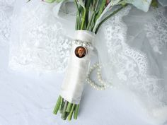 a bouquet of flowers with a bride's photo in the center on a white background