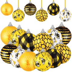 a bunch of yellow and black christmas ornaments