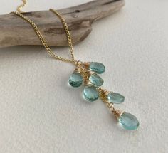 A stunning cascade of sparkling teardrop-shaped aquamarines, carefully hand-woven in gold or silver thread and hung on a delicate fine metal chain. A statement piece of jewellery for your Mother, Daughter, Sister and Friend that is sure to turns heads! The Perfect March Birthday Gift. AQUAMARINE QUARTZ LARIAT NECKLACE DETAILS Available in 100% Sterling Silver and 14ct Rolled Gold All raw materials/gemstones are ethically sourced THE CRAFTING JOURNEY Handcrafted in my Northumberland Studio, this Gold Thumb Rings, March Birthday Gifts, Thumb Rings Silver, Woven Ribbon, March Birthday, March Birthstone, Gold Ring Stack, Chain Extenders, Teardrop Necklace