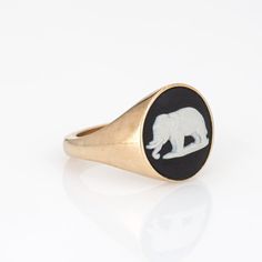 This is part of Chairish’s Fine Jewelry assortment.  Stylish Ferian elephant signet ring crafted in 9 karat yellow gold.   Wedgewood jasperware measures 13mm diameter (in very good condition and free of cracks or chips).   Made in Hatton Garden, England by Ferian (Founded in 2017), the signet ring features high polished gold with an Elephant cameo to the center. The distinct signet ring makes a great statement on the hand. The low rise ring (4.5mm - 0.17 inches) sits comfortably on the finger. Wedgewood Jasperware, Gold Elephant, Cameo Ring, Ring Crafts, Signet Ring, Low Rise, Ring Size, Elephant, Fine Jewelry