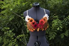 In honor of the changing of the seasons and the Autumnal Equinox, I wanted to create a bra that radiated the colors of Fall, with the flare of floral accents of the past. Theres floral for fall, and is decorated with fall leaves, and corresponding colors.  **Each bra is handmade individually, and therefore not look 100% to the original. When purchasing, please indicate the size in which you would like your bra to be made Please note that if you are in-between sizes, it is recommended you size up. Failure to give the correct/accurate sizing at checkout is on that of the customer, and not of the business owner.  **. *Larger Band&Cup sizes, as well as bra styles (plunge and t-shirt) available through the custom option, but please message with questions beforehand :) Decorated Bras, Flower Bra, Rave Babe, Autumnal Equinox, Bra Items, Colors Of Fall, Rave Bra, The Seasons, Fall Leaves