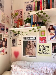 a bedroom with many posters on the wall