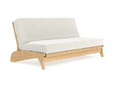 a white couch sitting on top of a wooden frame