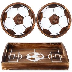 two wooden bowls with soccer designs on them