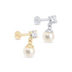 Elevate your jewelry collection with our stunning natural diamond earrings for women. Crafted with exquisite 14k gold flat back and adorned with beautiful pearls, these earrings feature both dangle and drop styles for versatile elegance. The comfortable 18g threaded design is perfect for earlobes, making them a delightful choice for everyday wear or special occasions. Whether you're looking for the perfect anniversary gift or a treat for yourself, these earrings combine luxury and timeless charm that will never go out of style Item Details * Metal: 14k Solid White and Yellow Gold * Size: 7 mm x 3 mm * Gemstone: Natural Diamond (2mm) and Pearl (3mm) * Total Carat Weight:  0.04 Carat  * Diamond Cut: Round Brilliant * Diamond Color: G-H, Clarity: SI1-SI2 * Setting Type: 4-Prong * Post Width: Earring Pearl, Diamond Earrings For Women, Flat Back Earrings, Lobe Piercing, Gold Flats, Gold Alloys, Solid Gold Jewelry, Pearl Earrings Dangle, Earrings Dangle