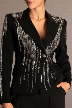 Elevate your wardrobe with the Faidra Rhinestone Double-Breasted Lapel Blazer, a stunning piece that merges classic sophistication with dazzling modern details. This tailored blazer features a timeless double-breasted design with sharp lapels, enhanced by shimmering rhinestone embellishments that catch the light with every move. The structured fit and refined cut provide a polished silhouette, while the sparkling accents add a touch of glamour and individuality. Perfect for both professional set Formal Fitted Blazer With Rhinestones, Fitted Rhinestone Blazer For Formal Occasions, Glamorous Fitted Blazer With Rhinestones, Elegant Embellished Evening Blazer, Elegant Evening Embellished Blazer, Elegant Fitted Blazer With Rhinestones, Elegant Black Blazer With Rhinestones, Elegant Evening Blazer With Rhinestones, Elegant Party Blazer With Rhinestones