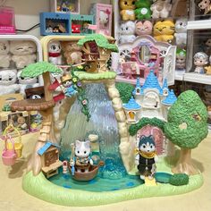 there are many stuffed animals and toys in the store together, including a tree house