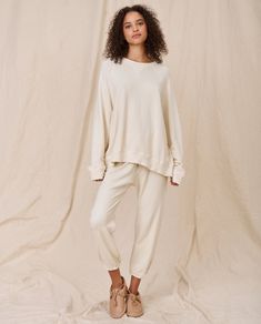 Inspired by a favorite vintage sweatshirt, this wear-with-everything piece has extra slouch, a straight shape, and fuller sleeves than The College Sweatshirt. 100% Cotton Machine Wash Cold Tumble Dry Low Made in the U.S.A. Relaxed Fit Sweatshirt For Lounging, Slouchy Crew Neck Tops For Loungewear, Relaxed Cotton Sweater For Loungewear, Relaxed Cream Tops For Fall, Casual Slouchy Crew Neck Sweatshirt, Casual Raglan Sleeve Sweatshirt For Loungewear, Daywear Crew Neck Tops With Ribbed Cuffs, Relaxed Fit French Terry Sweats For Loungewear, Oversized Raglan Sleeve Sweatshirt For Loungewear