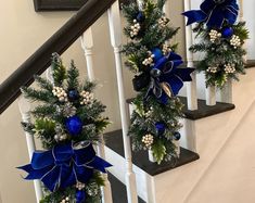 blue and white christmas decorations on the banisters