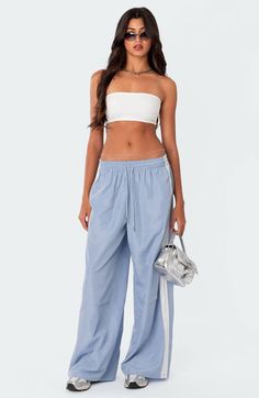 Find EDIKTED Fauna Track Pants on Editorialist. Sporty stripes trail the sides of these wide-leg track pants topped with a comfortable elastic waist. 100% polyester Machine wash, dry flat Imported Track Pants, Elastic Waist, Wide Leg, Light Blue, Track, Stripes, Elastic, Pants, Blue