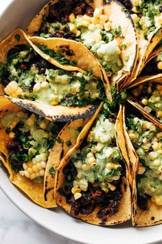 mexican food with corn and avocado on top