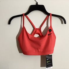 Nike Neon Pink Sports Bra. Never Worn, Still Has Tags. Has Pockets For Removable Cups, But Does Not Come With Cups. Nike Sports Bra With Built-in Bra For Training, Nike Seamless Sports Bra For Training, Nike Seamless Sports Bra, Sports Bra Fitted, Nike Activewear With Built-in Bra For Workout, Sports Bra Fitted Sportswear, Sports Bra With Fitted Stretch, Casual Light Support Bra For Workout, Casual Workout Bra With Light Support