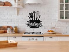 a kitchen with white brick walls and wooden counter tops has utensils hanging on the wall