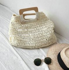 Look your summer best with this Annabelle straw shopper. The tote-bag design comes in two classic colors that will take you from the beach to the boardwalk and everywhere in between! So toss in your sunscreen and snacks, and get ready to tote in style! SIZE: W45 cm x H36 cm x D12cm / W17.7" x H14.2" x D4.7" Gender: WOMEN Item Type: Handbags, Shopper Tote Main Material: Straw Lining Material: Polyester Interior: Interior Slot Pocket, Cell Phone Pocket Hardness: SOFTDecoration: Magnetic Snaps Straw Beach Tote, Handbags Handmade, Summer Beach Bag, Retro Purse, Ladies Handbags, Oversized Bag, Straw Handbags, Straw Tote, Wedding Bag