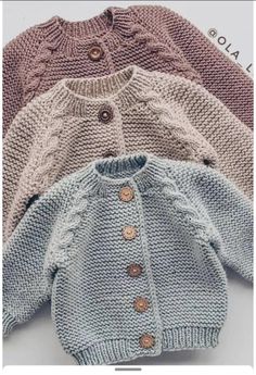 three knitted sweaters with buttons on the front and back, all in different colors