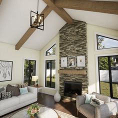 a living room with couches, chairs and a fire place in the middle of it