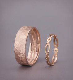 two gold wedding rings sitting next to each other on top of a gray surface with the words regular price $ 599 00 usa