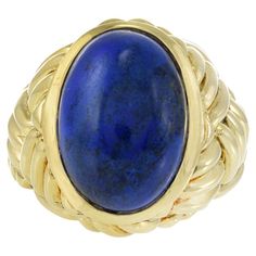 Step into the glamour of the 1960s with our Vintage 18KT Yellow Gold Ring, a true embodiment of retro chic. This statement piece features a distinctive weave pattern crafted in luxurious yellow gold, capturing the essence of the era's bold and stylish designs. The focal point is a natural lapis lazuli oval cabochon center, adding a touch of rich, deep blue to the ensemble. The ring's craftsmanship and unique design evoke the spirit of the swinging '60s, making it a standout accessory for those w Swinging 60s, Lapis Lazuli Ring, Weave Pattern, Yellow Gold Ring, Retro Chic, The 1960s, Retro Stil, Oval Cabochon, Yellow Gold Rings