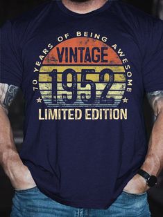 a man with his hands in his pockets wearing a t - shirt that says vintage 1953