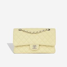 For timeless Parisian-chic there is no better investment than a Chanel classic flap bag. Created in a beautiful pale yellow caviar leather, in the coveted Medium size. This Chanel comes with all the iconic features including multiple compartments and pockets. The interwoven chain sits elegantly on your shoulder or doubled up on your arm. SPL Exterior Pale yellow caviar leather Silver tone hardware CC twistlock closure Slip pocket at rear of bag 2018 production Excellent condition - some light corner wear and hairline scratches to CC Interior Yellow leather interior Double flap Zip compartment on first flap Two slip pockets at interior wall Excellent condition - one small mark under second flap Sold with box and dustbag only SPL Height 16cm Width 26cm Depth 7cm Chanel Classic Flap Bag, Classic Flap Bag, Timeless Handbag, Yellow Leather, Parisian Chic, Leather Silver, Exclusive Bag, Pale Yellow, Classic Flap