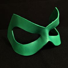 DESCRIPTIONCosplay Green Fury, alias for Fire (Beatriz da Costa), member of DC's Justice League International! Possess an array of abilities in this green leather mask, including altering your clothing at will, lfying, and exhaling mystical green fire! Also wear for Green Arrow at Comicon or Halloween. Any shade of green available. Waterproofed leather, glossy or matte finish, & several choices to affix the mask (cord, elastic, ribbon, waterproof cord, stick, or no holes for adhesive). Measu Mask Cord, Justice League International, Justice League Costumes, Avengers Outfits, Superhero Masks, Green Fire, Elastic Ribbon, Leather Mask, Fern Green