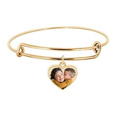 * Heart charm is custom laser printed using your uploaded photo  * Add optional engraving on the back * Expandable gold plated bracelet to fit any wrist * Heart charm measure 3/4 * Approx. weight: 6.7 Grams * Made of gold-plated stainless steel * Made in USA  Give a truly unique and custom gift with this Personalized Photo Heart Bracelet. Simply upload your most precious photo to have it permanently printed on a photo heart pendant.  A perfect gift for Mother's Day, birthdays, or just because. Customizable Gold Charm Bracelet, Customizable Round Gold Charm Bracelet, Customizable Gold Round Charm Bracelet, Gold Stainless Steel Heart Bracelet For Anniversary, Personalized Round Bracelets For Keepsake, Adjustable Gold Heart Charm Bracelet, Personalized Gold Stainless Steel Charm Bracelet, Gold Nickel-free Charm Bracelet For Personalized Gift, Personalized Heart Bracelet For Valentine's Day