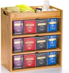 a wooden spice rack filled with lots of different types of spices