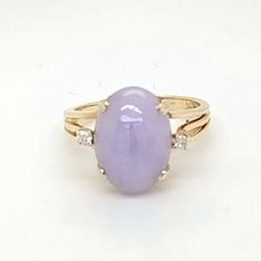 Lavender Jade Ring with Diamonds  This Stunning ring is absolutely magical! The beautiful lavender shade of Jade is just too perfect and the two small diamonds surrounding it really give it that extra sparkle, wow everyone with its beauty. -weight 4.45 gm -Ring size 7.5 -oval lavender jade 13.72x 10mm ring with two 2.0mm .05cttw SI-2H diamond accents -width:13.46/14.42/depth:9.88 shoulder:4.45 shank base:2.01 -13.46x14.4mm across the top, 9.88mm tall shoulders measure 4.45mm tapering to 2.0mm -m Amethyst Rings With Brilliant Cut, Purple Sapphire Ring With Brilliant Cut, Fine Jewelry Purple Rings With Diamond Accents, Elegant Purple Diamond Ring With Center Stone, Formal Purple Sapphire Ring With Diamond, Elegant Purple Diamond Ring For Anniversary, Timeless Purple Gemstone Rings, Luxury Lavender Ring With Center Stone, Tanzanite Diamond Ring With Accents