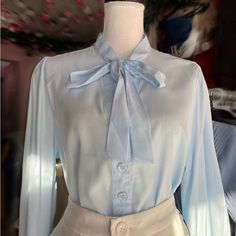 Blue Blouse For Women Light Blue Spring Office Shirt, Light Blue Office Shirt For Spring, Light Blue Shirt For Office In Spring, Light Blue Shirt For Office, Spring Season, Elegant Light Blue Summer Shirt, Light Blue Blouse For Fall Workwear, Chic Blue Shirt For Spring, Chic Light Blue Blouse For Fall, Blue Feminine Blouse For Work