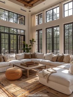 a large living room with lots of windows