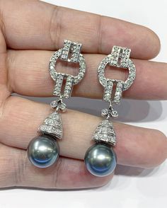 We are presenting you a HUGE pair of Art Deco, CHANDELIER, Genuine, LUSTROUS GRAY TAHITIAN, South Sea Pearls, extremely FINE AA+, LUSTROUS and Rare! Accenting the 2 pearls are 102 pieces of E/VS Natural diamonds, weighting a total of 1.65 carats. Set in GORGEOUSLY designed 18K solid white gold Art Deco earrings! PERFECT FOR SPECIAL OCCASIONS! SO BIG AND GORGEOUS! EVERYONE WILL FALL IN LOVE WITH THEM THE MINUTE THEY SEE YOU WEARING THEM! ONLY ONE ITEM AVAILABLE!! NO DUPLICATES!! WHAT YOU SEE IN T Luxury Tahitian Pearl Wedding Earrings, Tahiti Wedding, Gold Art Deco Earrings, Deco Chandelier, Earrings Chandelier, Art Deco Chandelier, Gold Art Deco, Vs Diamond, Art Deco Earrings