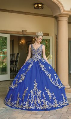 Long a-line quinceanera ball gown with v-neckline and gold embroidery.