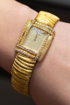 For Sale on 1stDibs - This beautiful watch is encrusted with 216 brilliant round diamonds. Diamonds weighing 2.40 carats total, E-F color and VS clarity. Made in 18 karat yellow Luxury Yellow Gold Diamond Watch With Brilliant Cut, Timeless Yellow Gold Brilliant Cut Diamond Watch, Yellow Gold Diamond Watch With Brilliant Cut For Anniversary, Luxury Gold Diamond Watch With Brilliant Cut, Luxury Yellow Gold Diamond Watch, Gold Diamond Watch With Brilliant Cut For Anniversary, Formal Gold Diamond Watch With Brilliant Cut, Luxury Yellow Gold Diamond Watch With Diamond Accents, Luxury Gold Diamond Watch With Diamond Accents