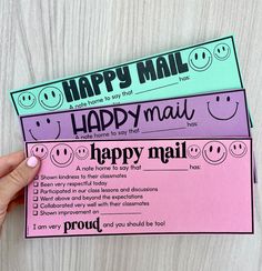 two happy mail envelopes with smiley faces on them, one is pink and the other is blue