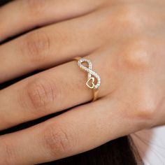 14k Solid Gold Infinity Ring, Heart Ring, Minimalist Real Ring, Heart Ring for Women, Love, Gift For Mom, Gift For Christmas INFINITY RING What is an infinity love ring? Also known as the promise ring, this ring is typically designed to symbolize unending love, signifies eternal devotion and everlasting love. The infinity heart ring has long been used as a token to express the promise of a lifetime commitment in a romantic relationship. Couples wishing to celebrate their unbreakable bond or to mark their commitment to each other may opt for infinity rings. It is the perfect gift for your special person as a symbol of love that goes on and on forever. ▷ Material  : 14k Solid Gold ✔ Each order will be sent to you with a box to avoid any damage during shipping. ✔ Visit our store, browse other Heart Infinity Ring, Fiance Ring, Gold Infinity Ring, Couple Ring Design, Fleurs Diy, Romantic Relationship, Desain Signage, Ring Heart, Gold Rings Fashion