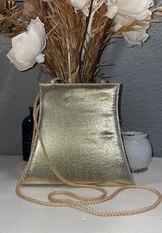 "I am the only prior owner of this little purse, I believe I used it for a wedding, then stored it away.  The purse has an option for a double strap carrying handle or a crossbody strap, neither are removable though.  It does have a little pocket inside, snaps shut on the top.  It's either late 80's or early 90's, lovely condition.   The crossbody strap has a 22\" drop - see photos for measurements of the purse itself." Formal Evening Shoulder Bag With Adjustable Strap, Party Clutch Shoulder Bag With Adjustable Strap, Chic Gold Evening Bag With Adjustable Strap, Elegant Formal Evening Bag With Adjustable Strap, Vintage Gold Shoulder Bag For Party, Vintage Gold Shoulder Bag For Formal Occasions, Formal Satchel Clutch With Adjustable Strap, Gold Handheld Shoulder Bag For Evening, Gold Crossbody Shoulder Bag For Formal Events