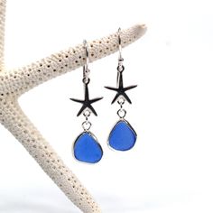 starfish and blue glass drop earrings on a white background