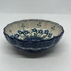 a blue and white bowl sitting on top of a table