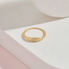 The Iconic Diamond Signet Star Ring is the pinnacle of minimalist design and elegant rings. Its plainness with modesty which is embellished with a single diamond will fascinate people around you. It is perfect for everyday use and ring stacking. - Made in 14k Solid Gold - Decorated with handset 0.025 ctw white diamond on 14k solid gold - Diamond Color and Clarity: G Color SI clarity - Top Width: 4.13 mm / 0,16 inches- Bottom Width: 1,45 mm / 0,06 inches- Thickness: 1.23 mm / 0,05 inches - This p Minimalist White Gold Star-shaped Ring, Minimalist Star-shaped White Gold Rings, Minimalist White Gold Star Shaped Ring, Elegant Star-shaped Crystal Promise Ring, Minimalist Star Shaped Diamond Jewelry, Minimalist Crystal Ring With Polished Finish, Minimalist Star-shaped Diamond Jewelry, Elegant Star Shaped Ring With Single Diamond, Minimalist Diamond Crystal Ring