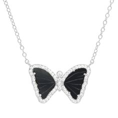 This Mini Butterfly Necklace in Black Onyx has hand-carved genuine black onyx butterfly wings set in gold-plated 925 sterling silver. Black butterflies are seen as symbols of positive change and new beginnings. Black onyx wings surrounded with crystals Gold-plated, 926 sterling silver Adjustable slider chain up to 18" Dimensions: 18x12mm Elegant Black Butterfly Necklace, Gift Black Jewelry With Wing-shaped Pendant, Wing-shaped Black Jewelry Gift, Black Wing-shaped Jewelry Gift, Wing-shaped Black Jewelry For Gifts, Black Wing-shaped Jewelry For Gifts, Elegant Black Butterfly Charm Necklace, Black Butterfly Charm Jewelry, Black Butterfly-shaped Jewelry For Gift