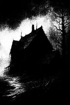 a black and white photo of a house in the woods at night with light coming from behind it